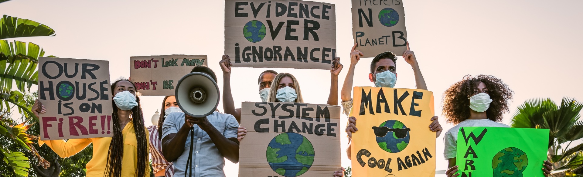 Climate change protestors holding signs