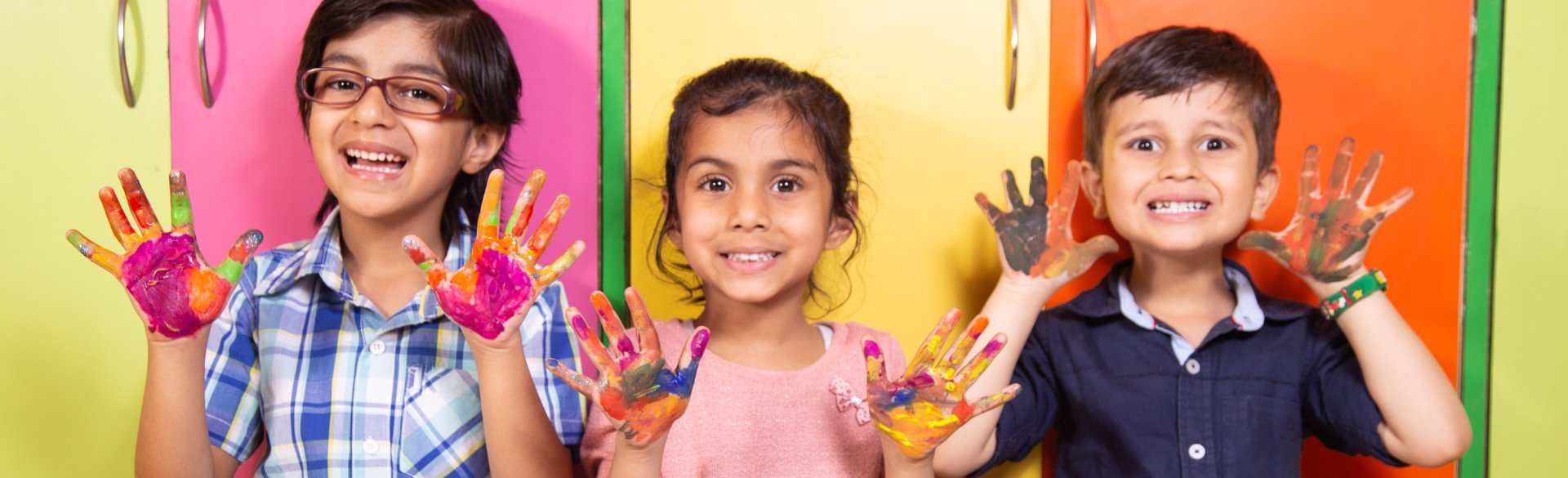 Three kids with paint on their hands