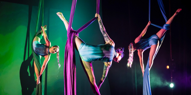 Emilee Mikaliger performing with aerial silks 