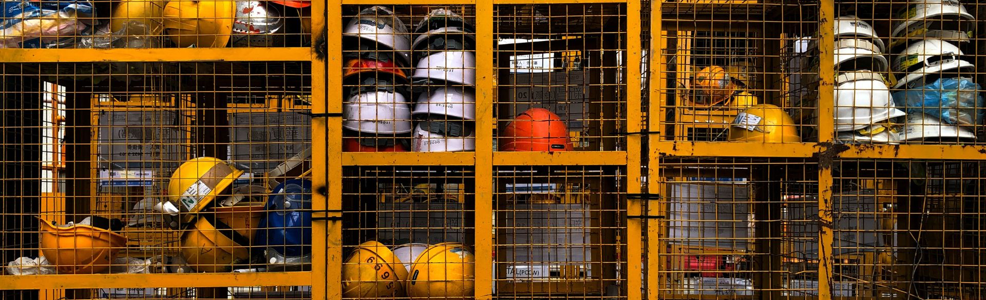 Hard hats in netted cabinet