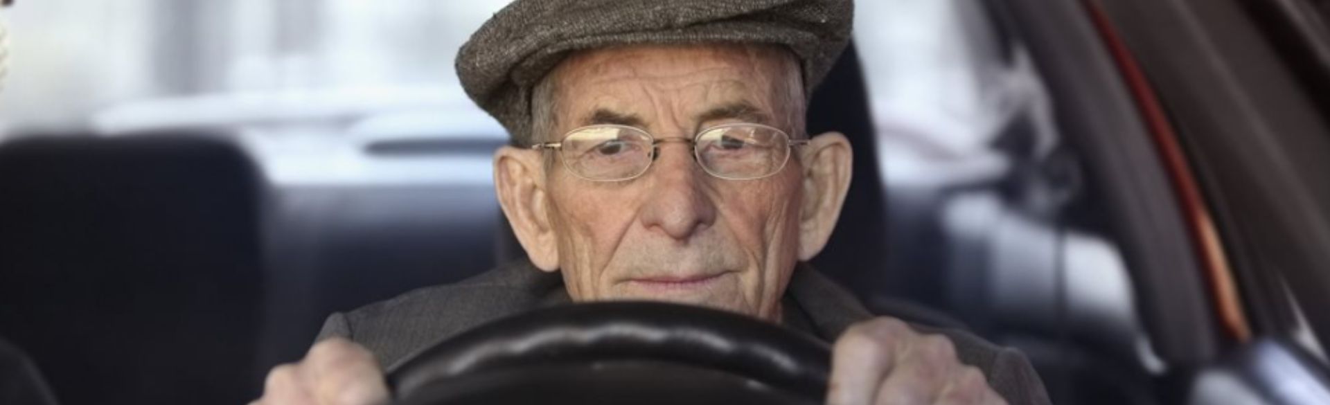 Old man driving car
