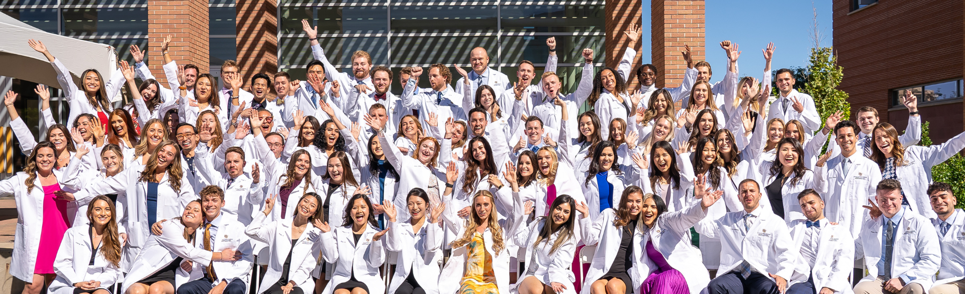 dental students celebrating at their white coat ceremony