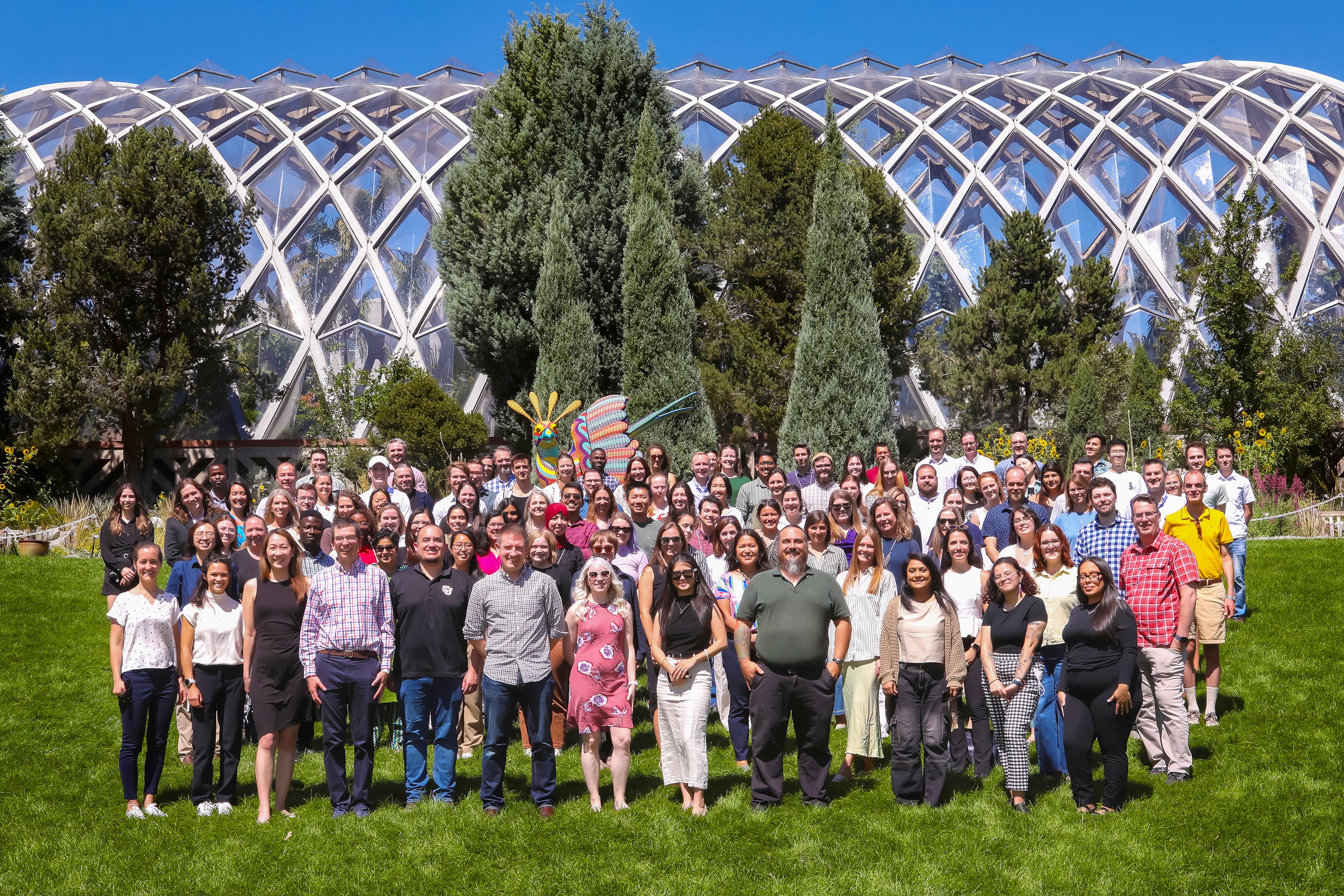 Group photo of DBMI members outside at the Denver Botanic Gardens