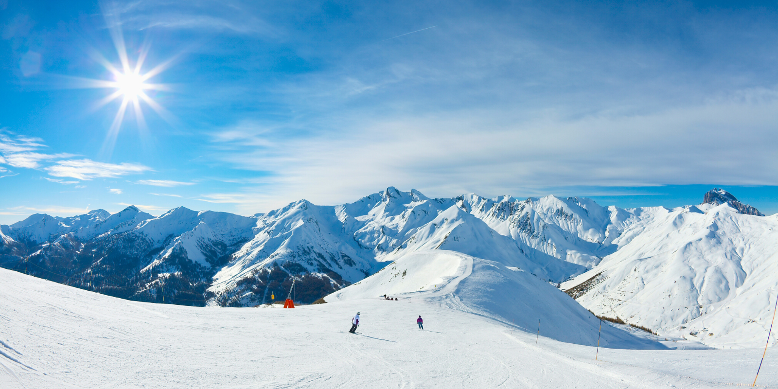 People skiing on a snowy mountain.