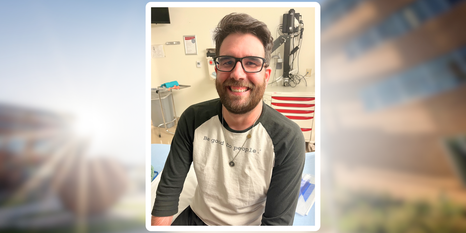 Bobby Click smiling while wearing a shirt that says, 