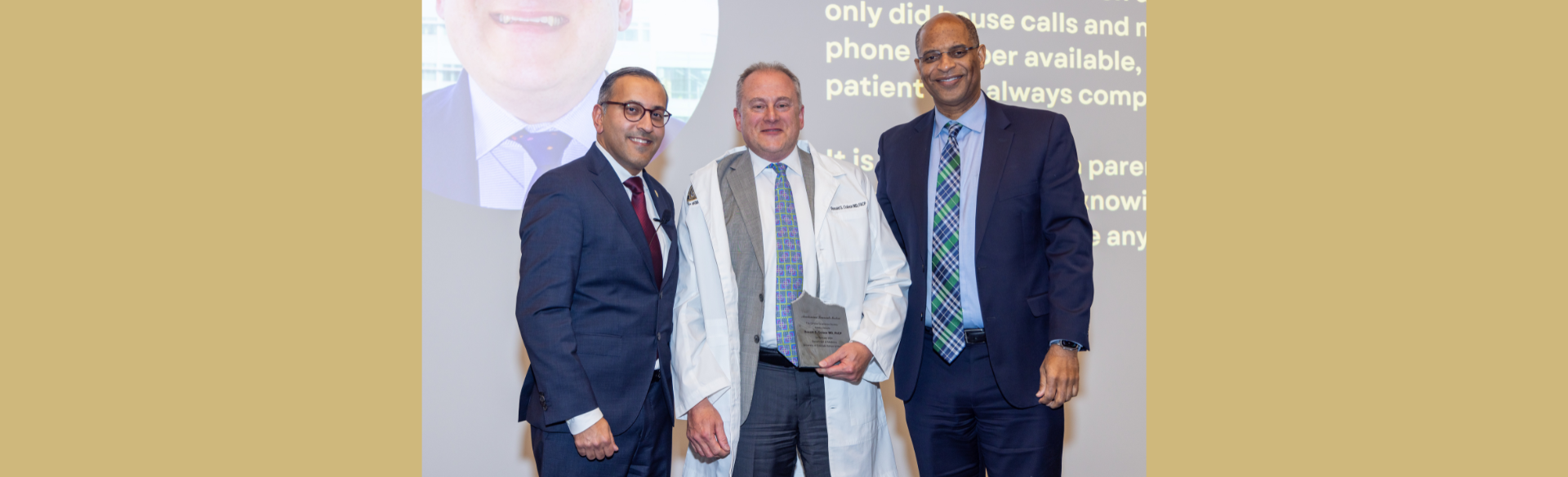 Ronald Colson, MD, being inducted into the Department of Medicine's Clinical Excellence Society.