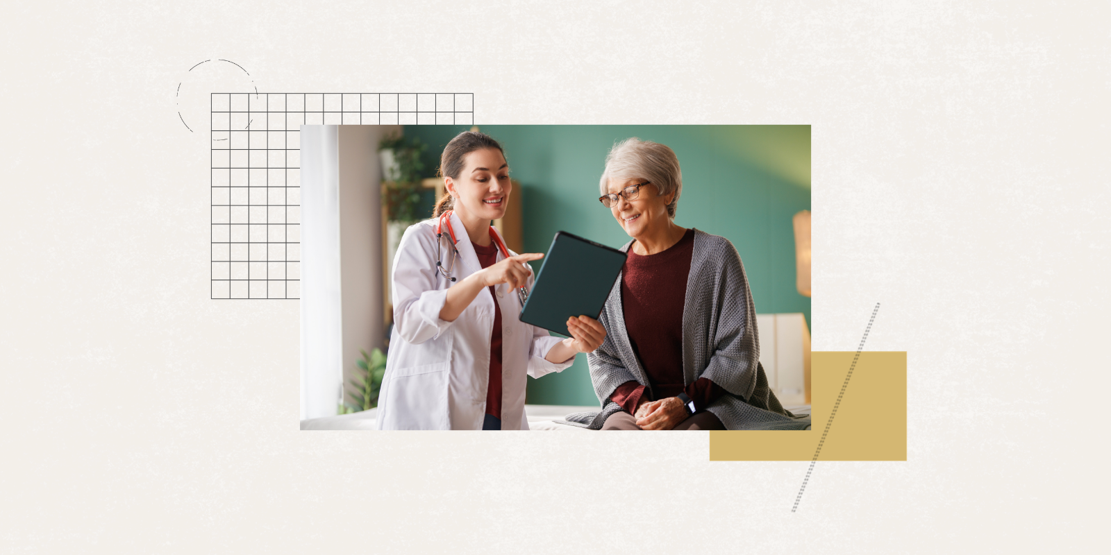 A doctor wearing a white coat points to a tablet device and shows it to an older adult woman who is sitting down.