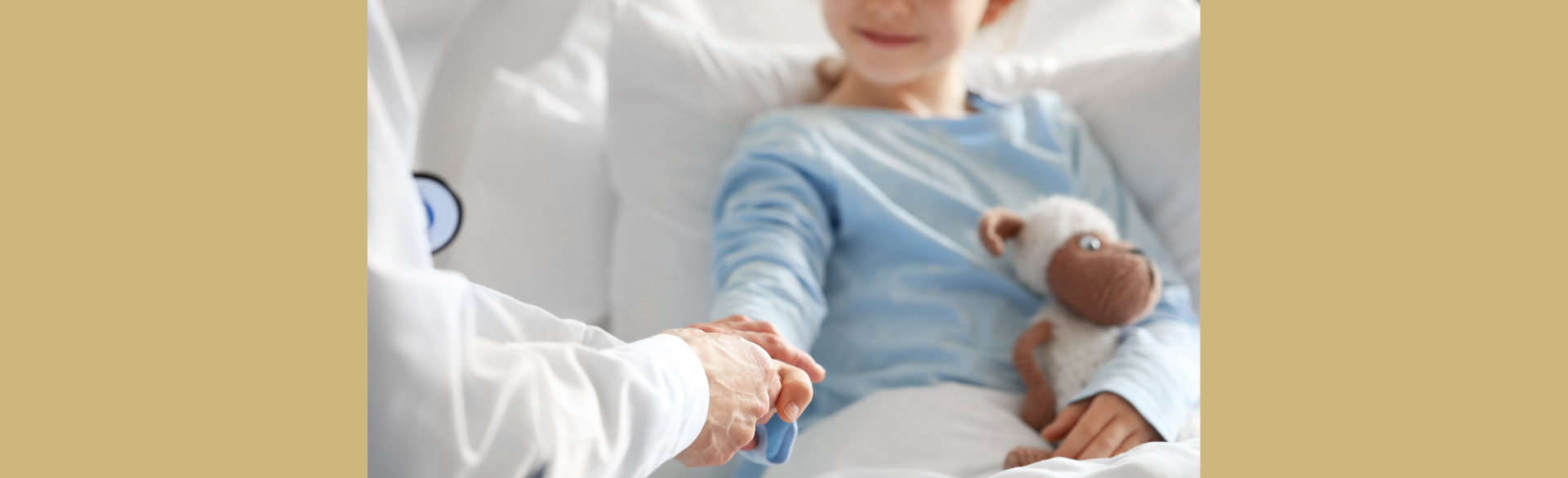 A child holding the hand of a physician.