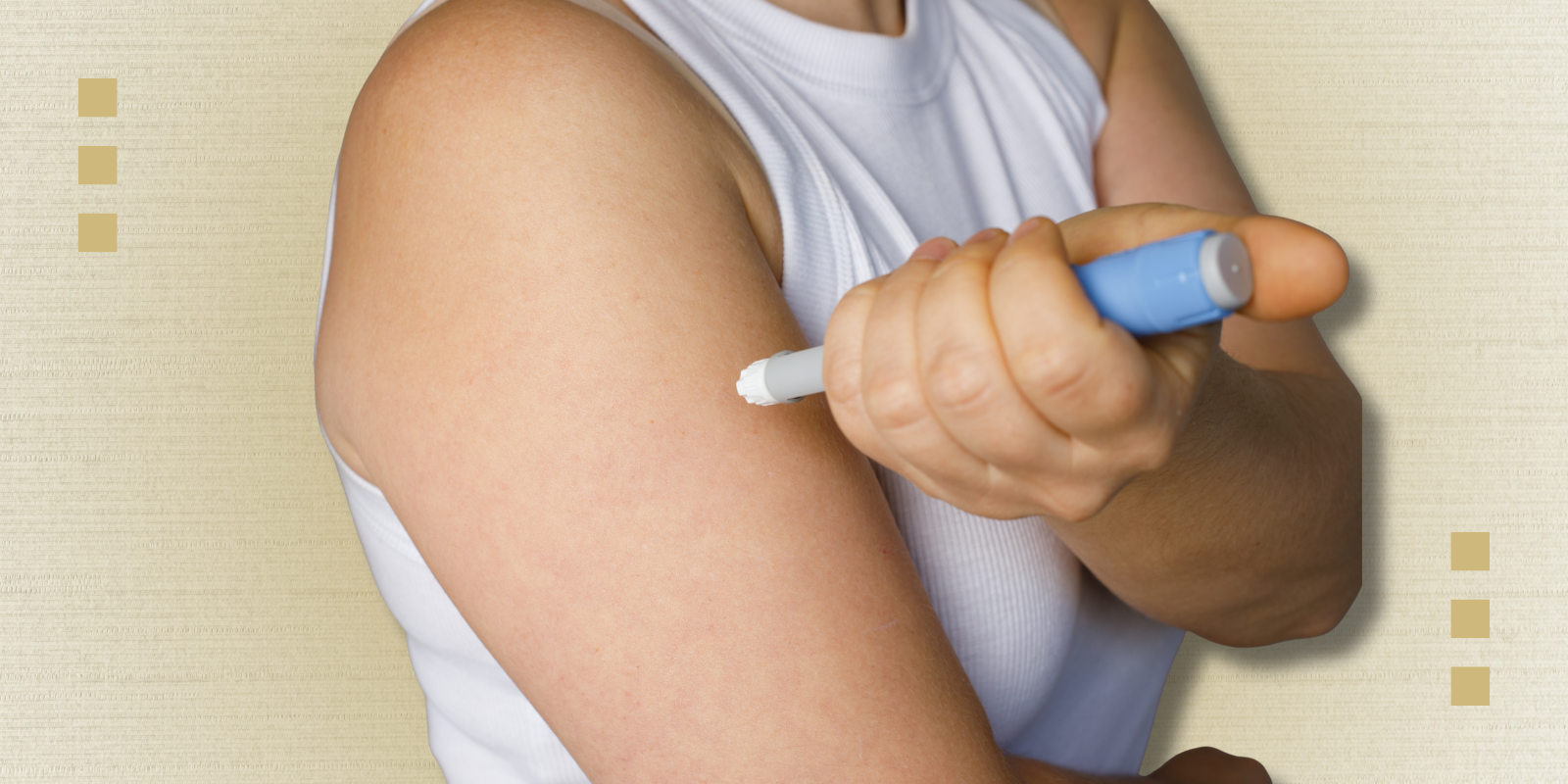 A person injects medication into their upper arm.