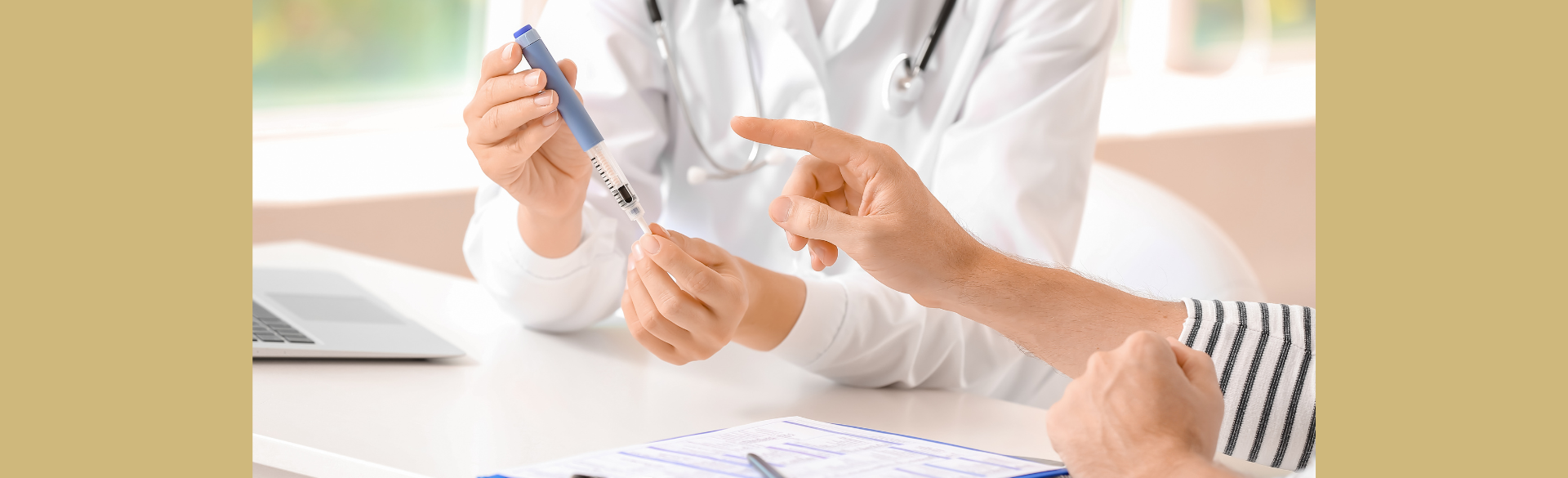 A doctor holding a syringe while sitting beside a patient.