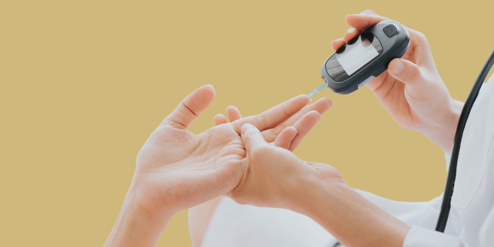 A doctor checks the blood glucose levels of a patient.