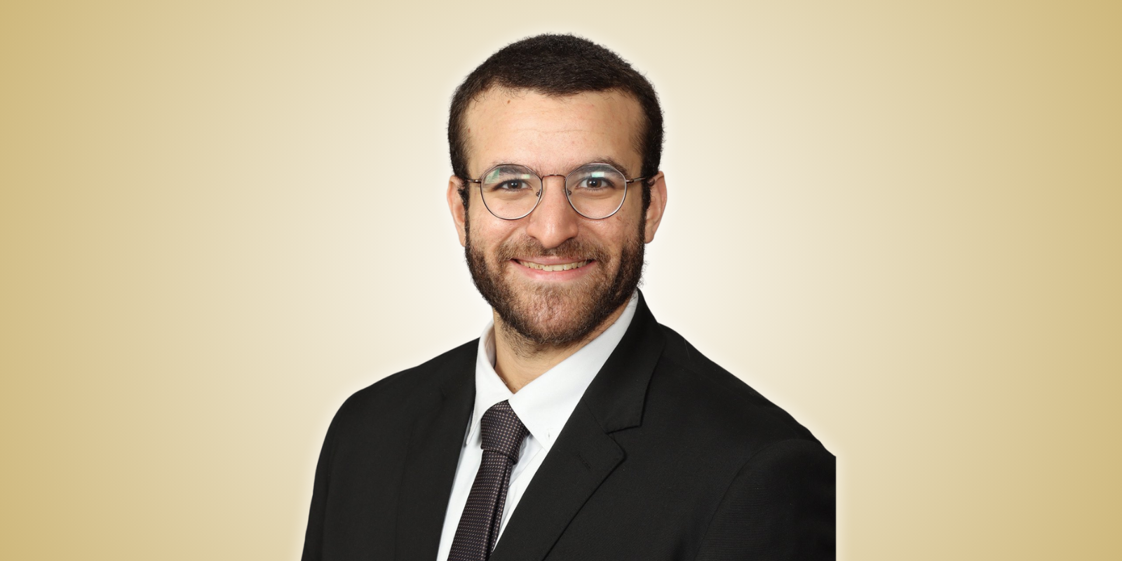 Marwan Hamed, MD, wearing a suit and glasses.