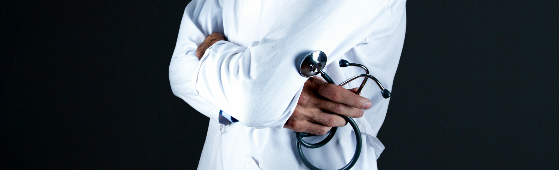 Physician holding a stethoscope.