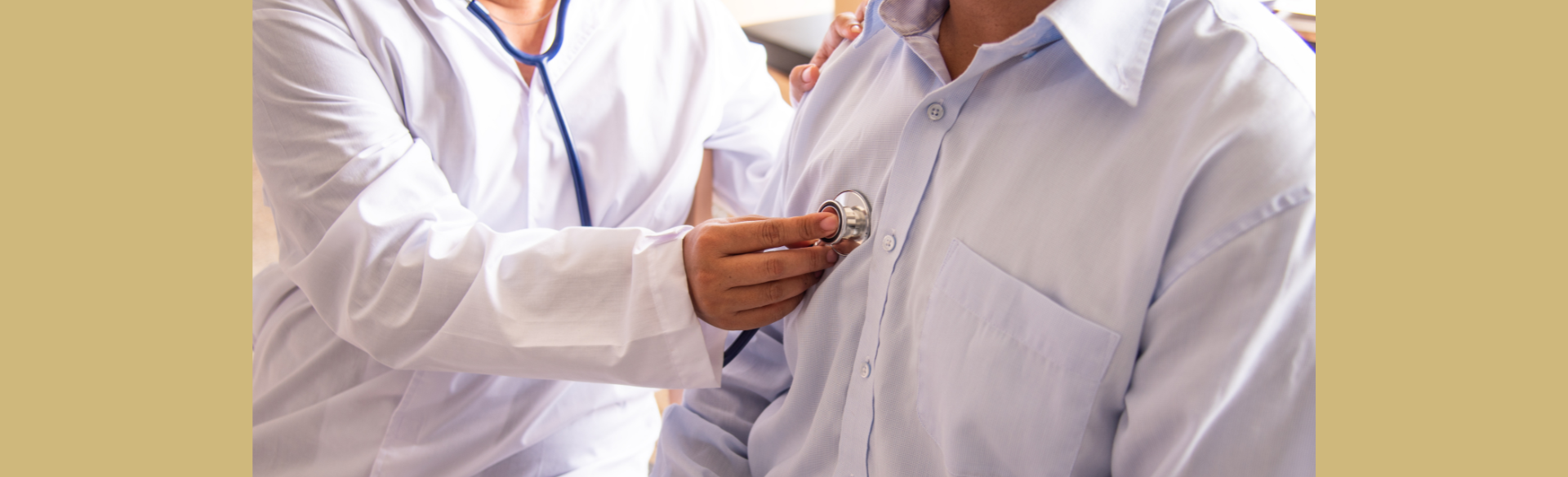 A doctor listens to the heart beat of a patient.