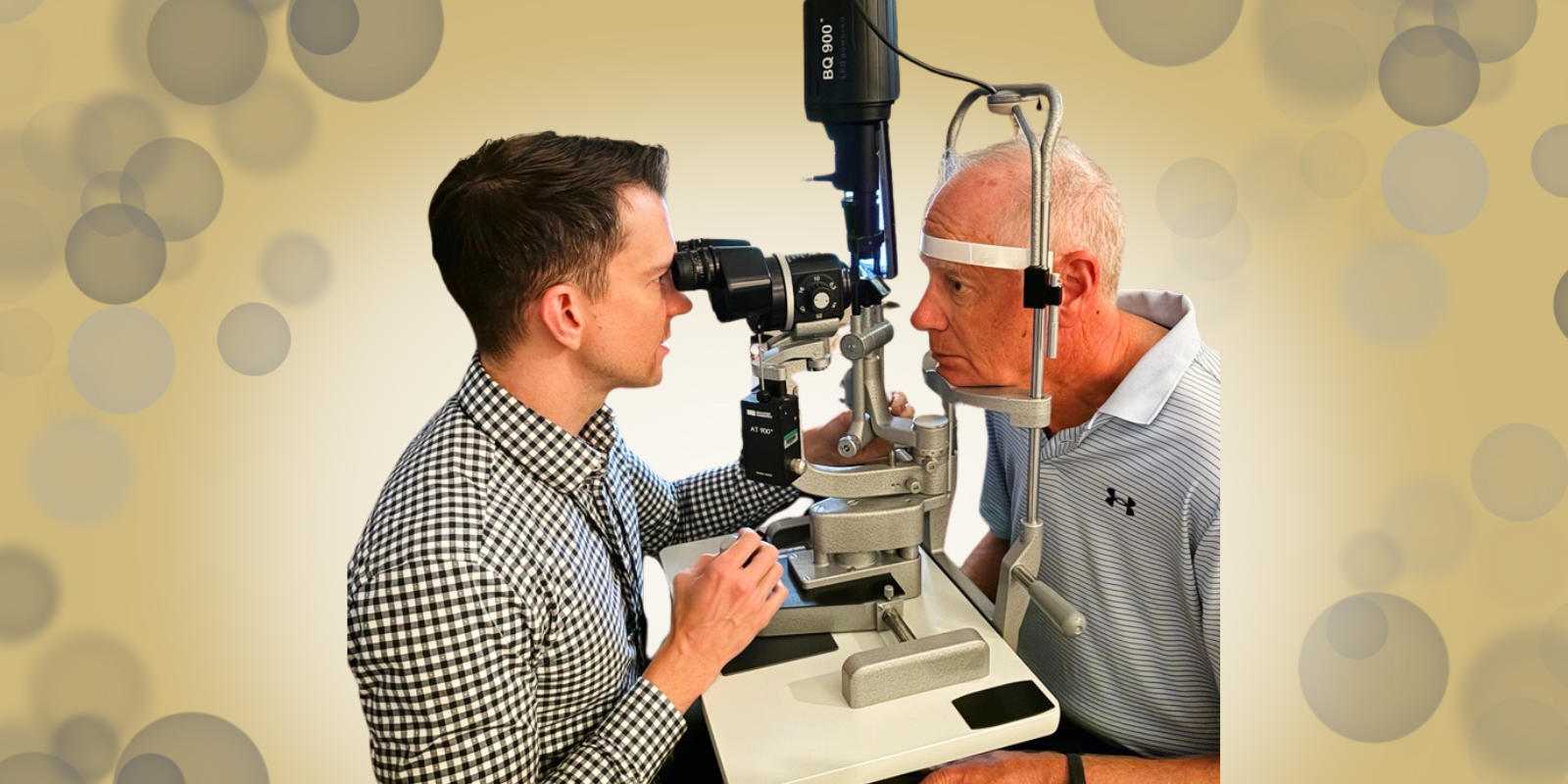 An ophthalmologist performs an eye exam on an older male adult.