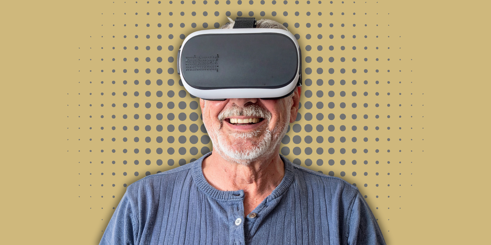 A male older adult wears a virtual reality headset.