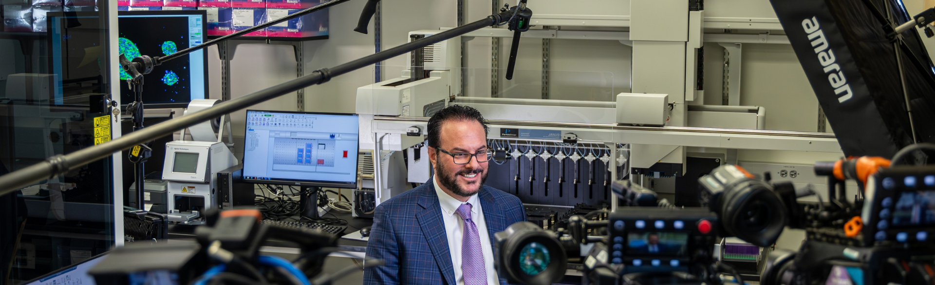 Dr. Dan LaBarbera smiles in his lab. He is surrounded by video cameras during an interview with CNBC.