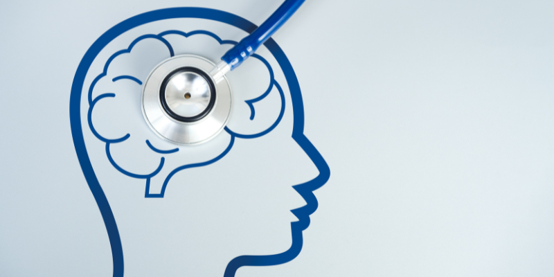 Stethoscope over the picture of a brain.