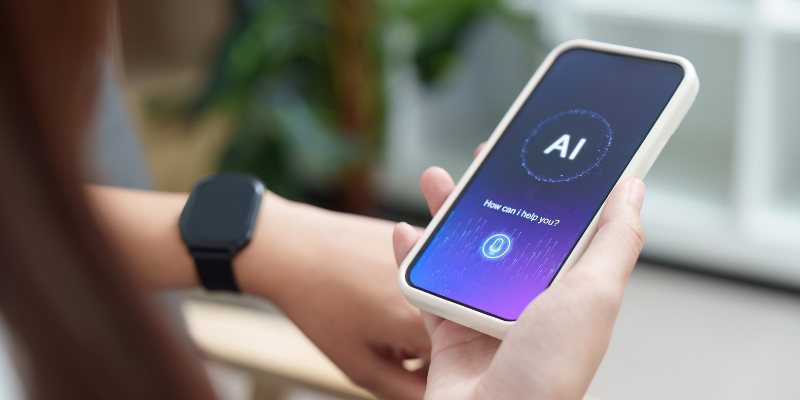 Person holding a phone that read "AI"