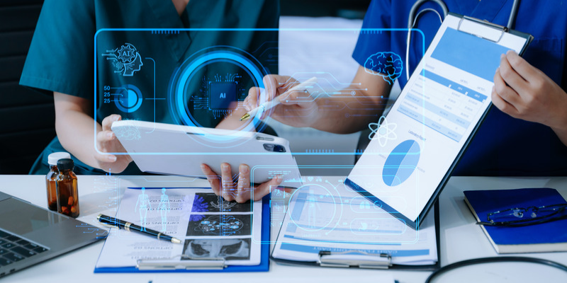 Doctors looking at data with "AI" logo over it.
