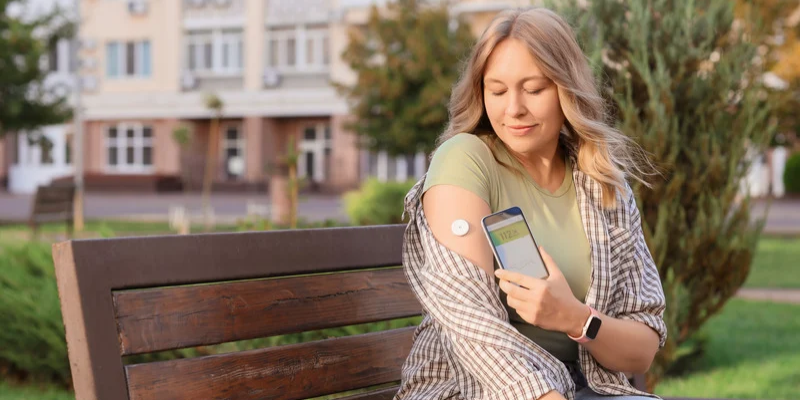 Women with medical device on her arm.