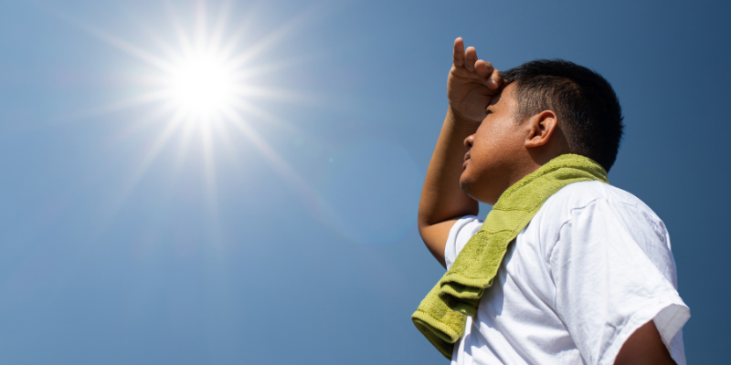 Someone looking up at the sun.