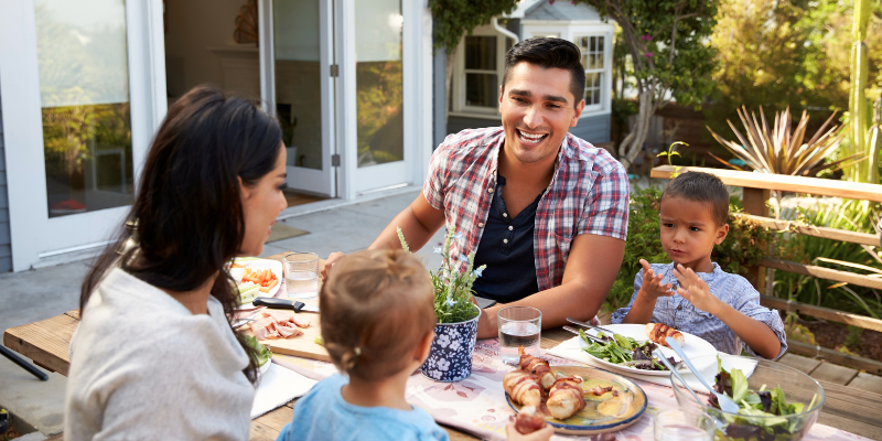 Family eating dinner together.