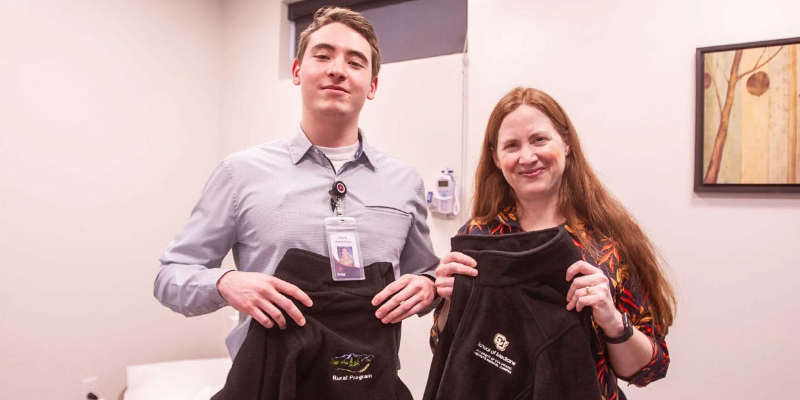 Hank Brand, second year medical student and 2nd Lt. in the Air Force, and Megan Lykke, MD, and professor with the University of Colorado Anschutz School of Medicine, pose for a photo at the PrimeHealth+ building in Grand Junction.