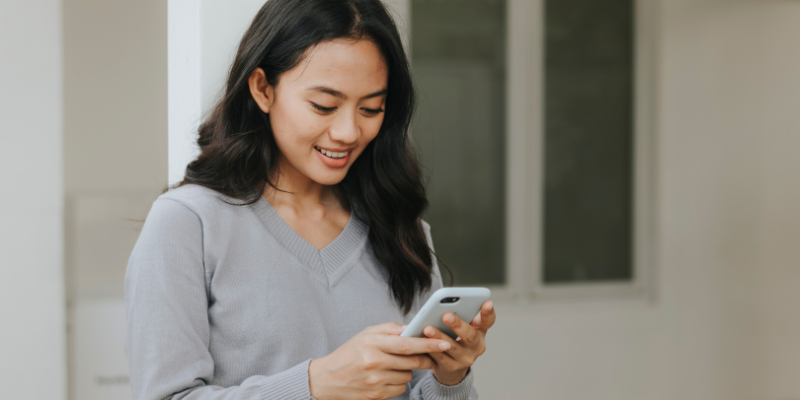Woman looking at her phone.