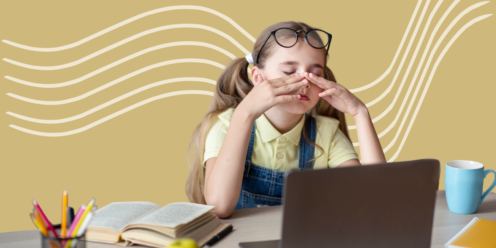 Young girl sitting in front of a computer. Her glasses are on top of her head, she is holding her eyes.