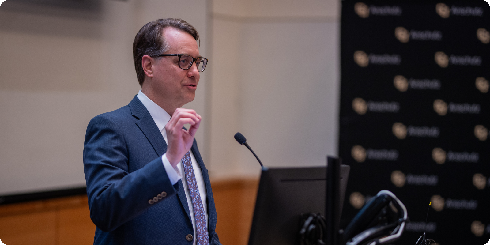 CU Anschutz Vice Chancellor for Research Thomas Flaig, MD, speaking at a podium. 