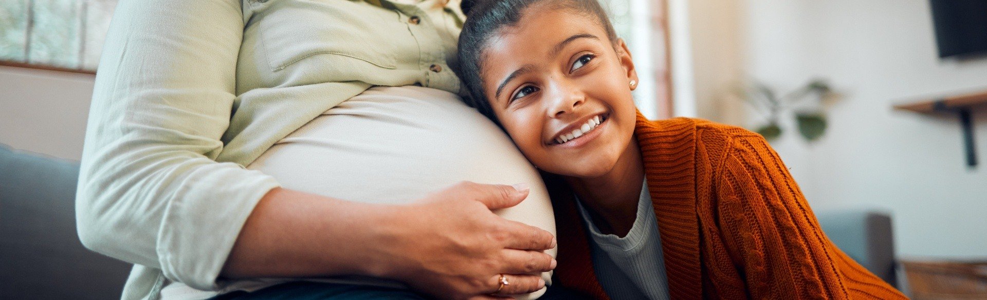 Pregnant mom and child smiling