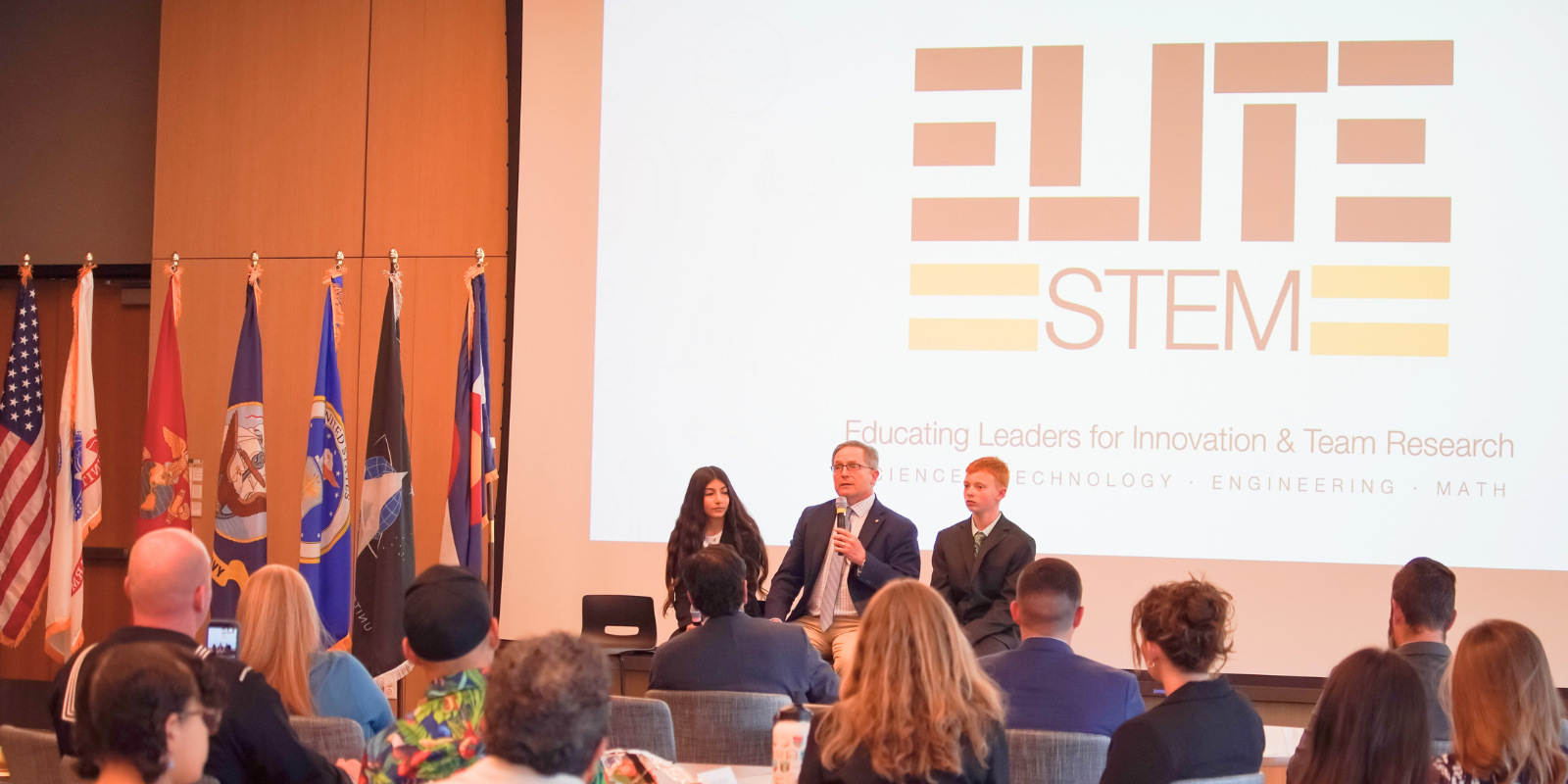 Students Gianna Azar (left) and Tristyn Cvanciger (right) are joined by Matthew Talarczyk, MD, FACS, at the STEM ELITE event.
