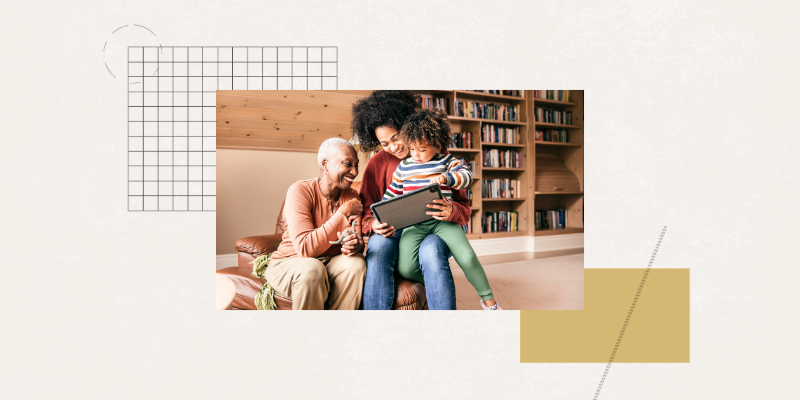 A grandmother, mother, and daughter reading together.