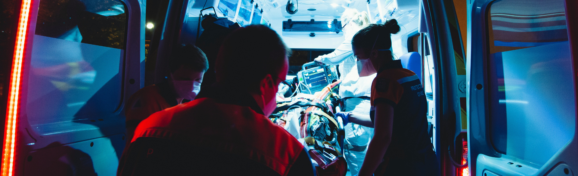 first responders load patient into ambulance