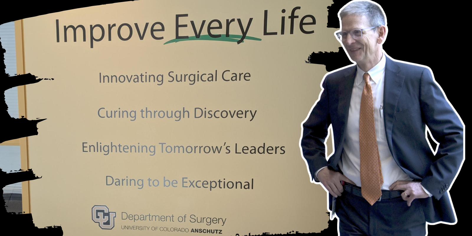 McIntyre standing next to Department of Surgery slogan: Improve Every Life