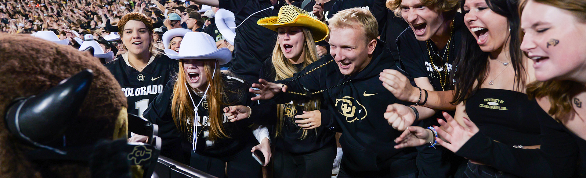 Chip the mascot interacts with happy CU Buffs fans