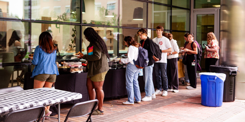 Students go through the Grad School Griddle food line