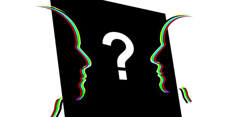Question mark with face silhouettes on either side