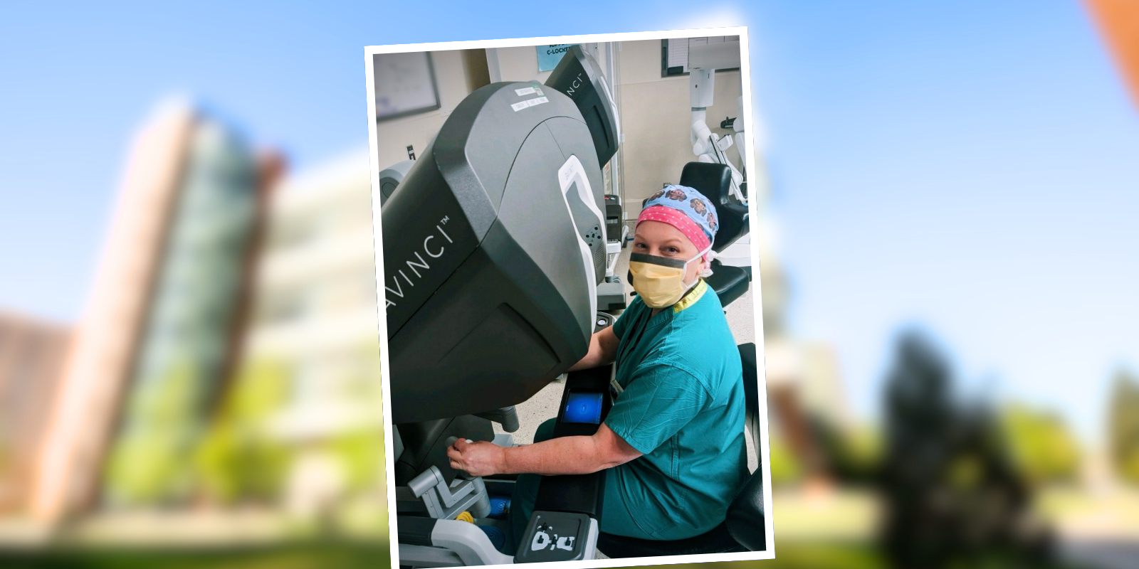 Kristy Hawley, MD, MPH, at the controls of the surgical robot.