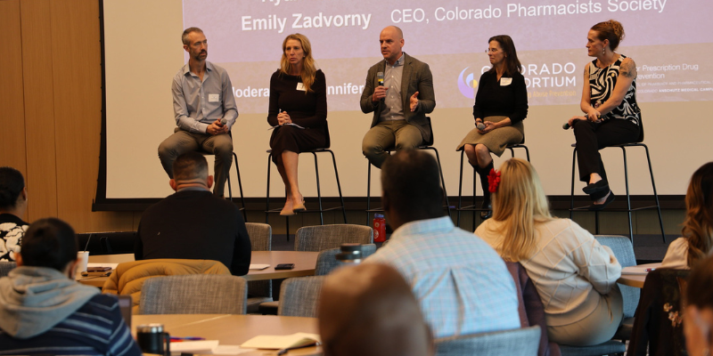 Panelists speak at the Consortium meeting.