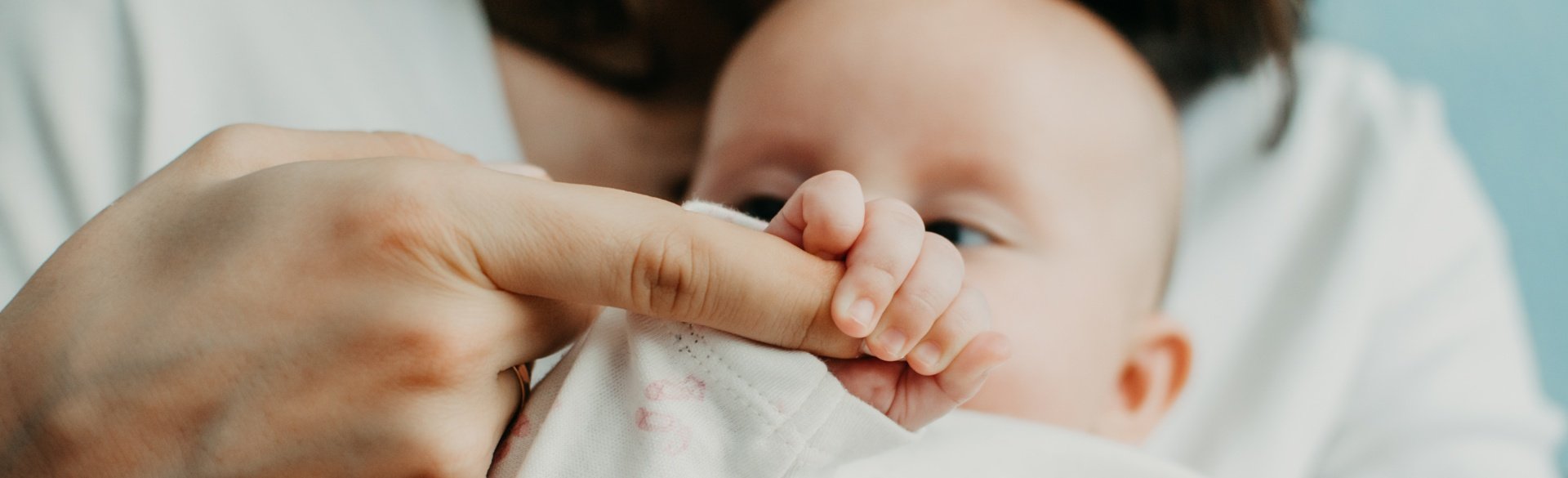 Baby holding a finger