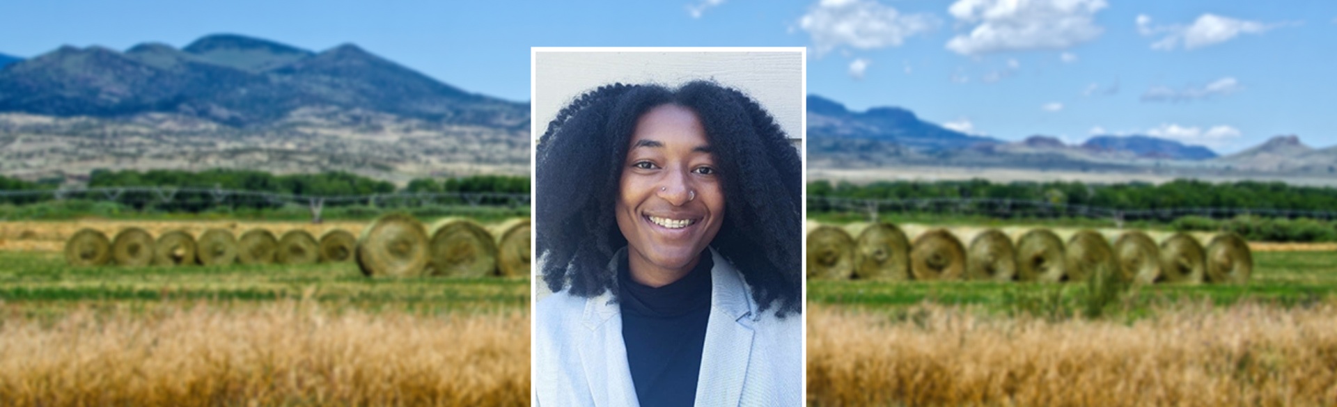 Woman smiling in headshot on background of Colorado mountains