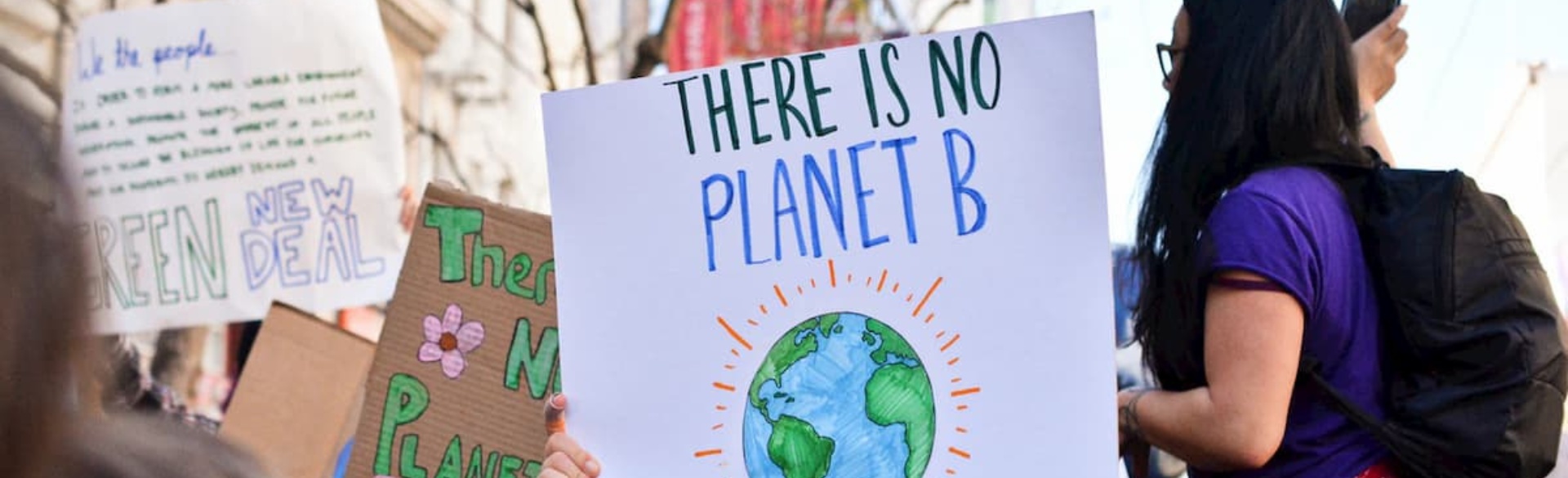 Climate change posters reading there is no planet B and other familiar sayings