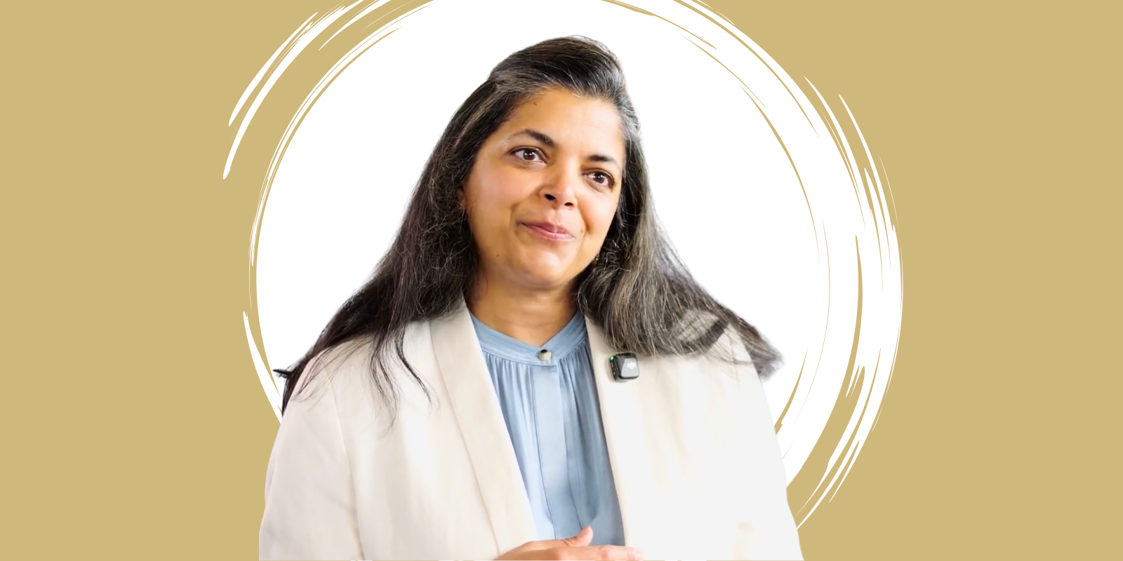 Woman in a white coat in front of a white swirl on a gold background