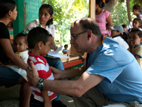 Dr. Asturias examining a child a the clinic