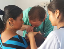 Pediatric resident Jacob Mark examines a child's ear