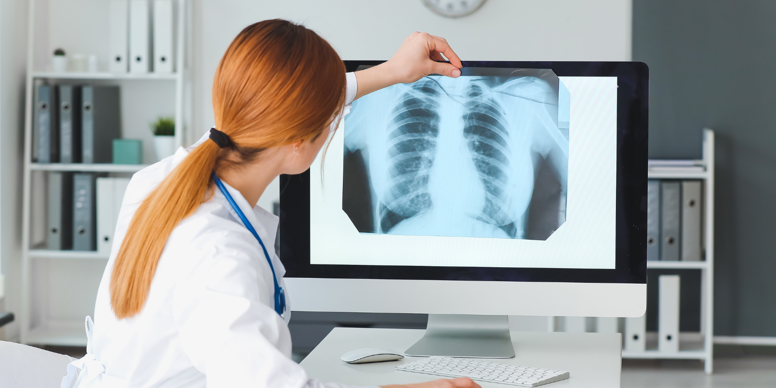 doctor examining lung x ray