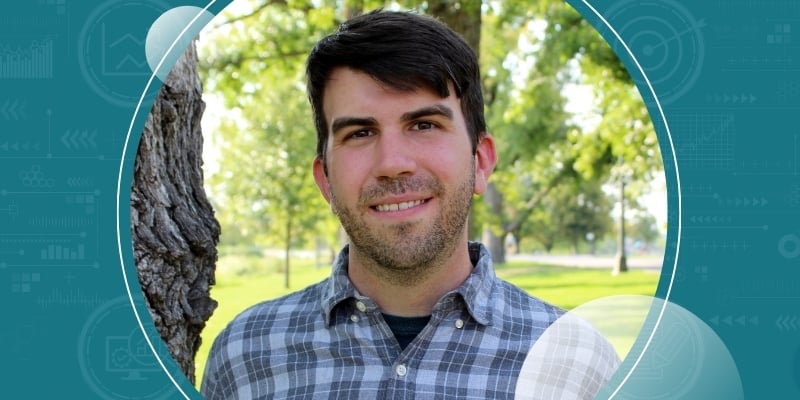 Kevin Josey enveloped in illustration of blue information graphics