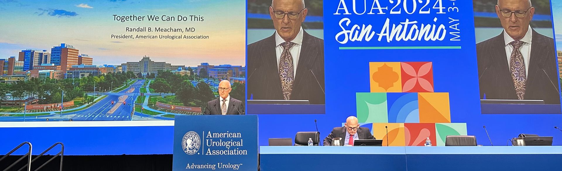 Meacham speaking at an AUA meeting.